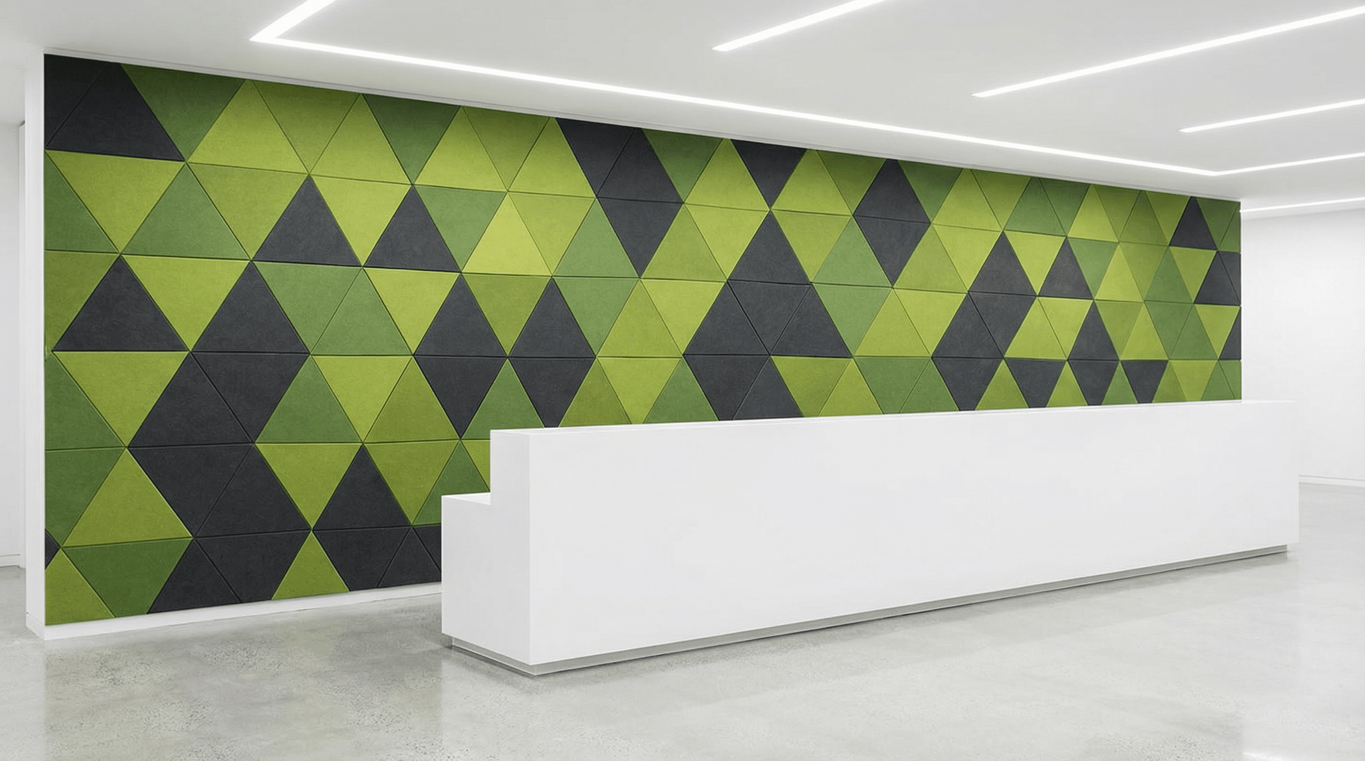 A modern reception area features a white desk and a wall decorated with green and black triangular acoustic panels in a geometric pattern, showcasing how AI for Acoustic Design enhances both the minimalist style and sound quality.