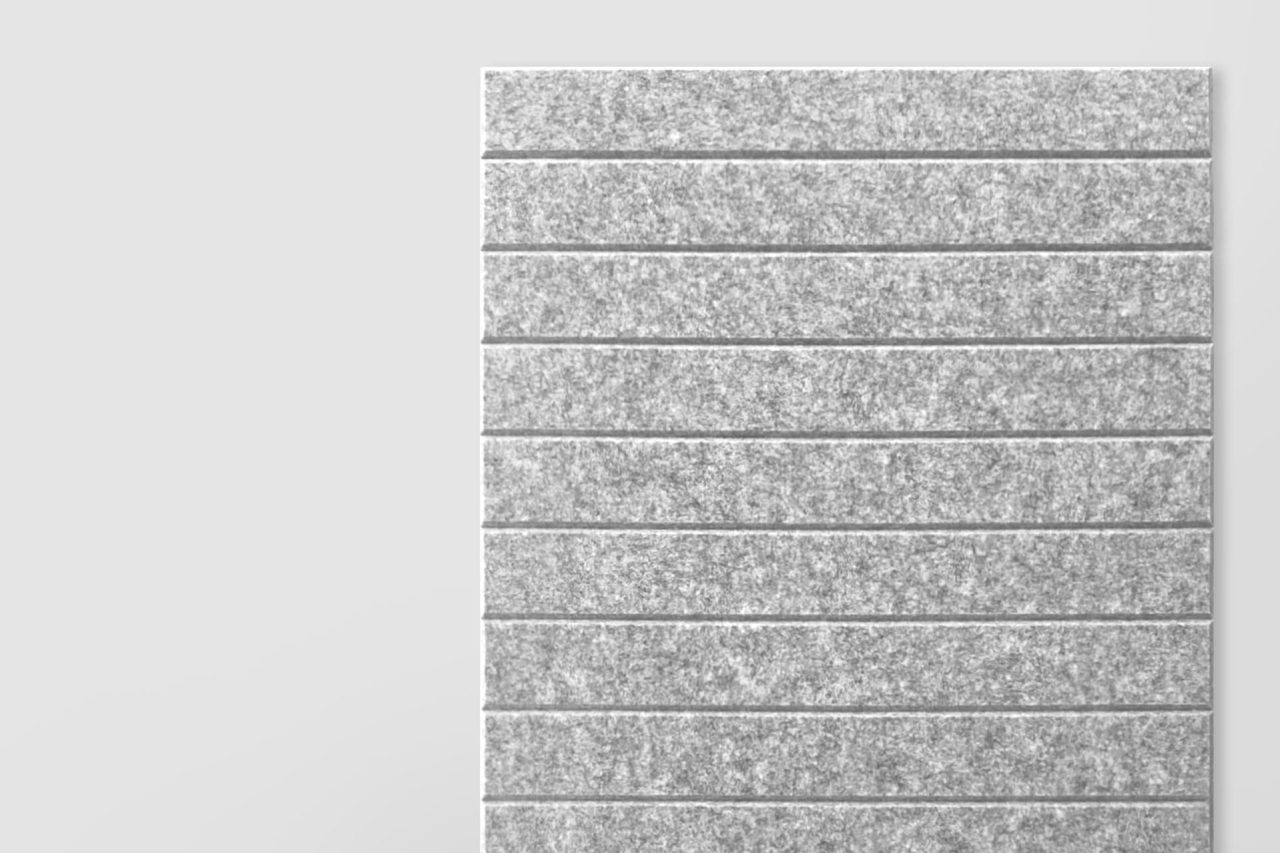 A rectangular gray felt panel, part of our Polyester Acoustic Panels offerings, features evenly spaced horizontal grooves. Set against a plain light gray background, the panel covers the right side while the left remains empty.
